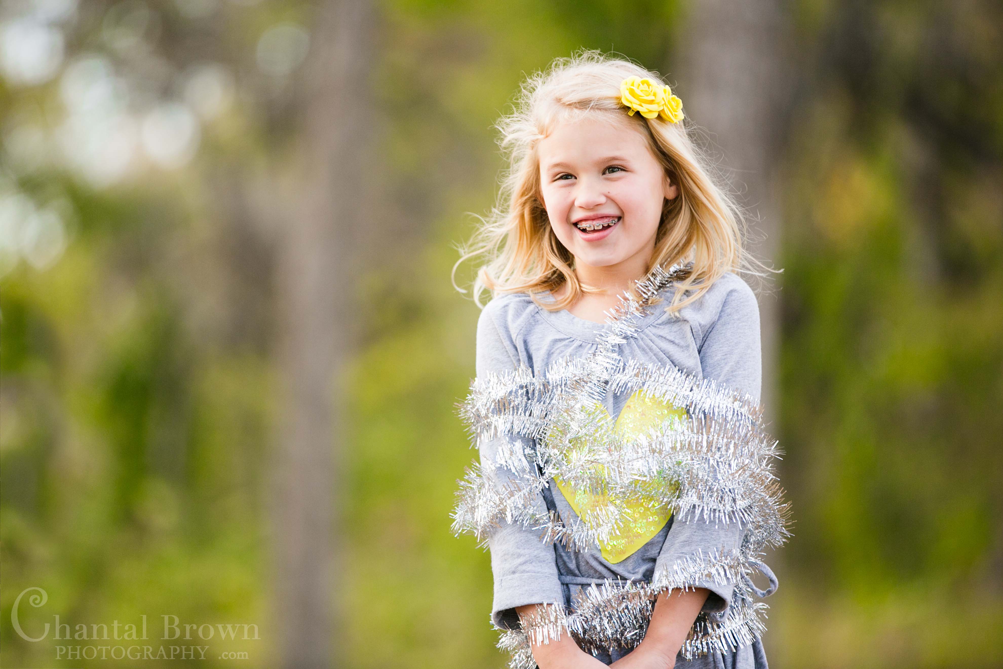 Richardson-Breckinridge-Park-17 Playing with Christmas decorations in pretty fall autumn color field covered with leaves Children Portrait at Breckinridge Park in Richardson Texas